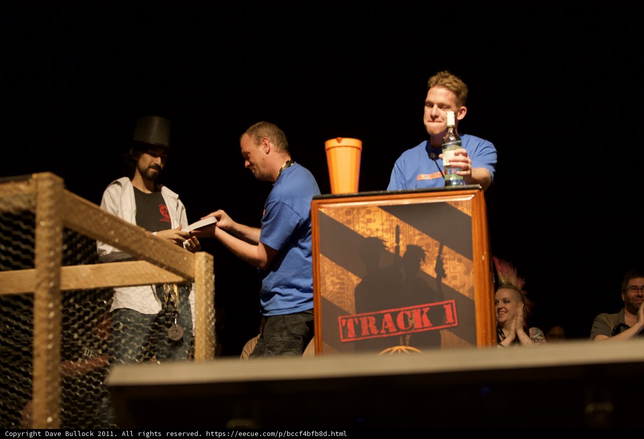 Two Men Deliver Speech on Plywood Podium