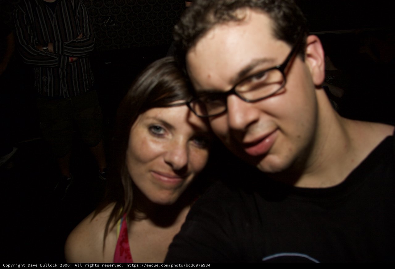 Two Friends Share a Moment at Late Night Party
