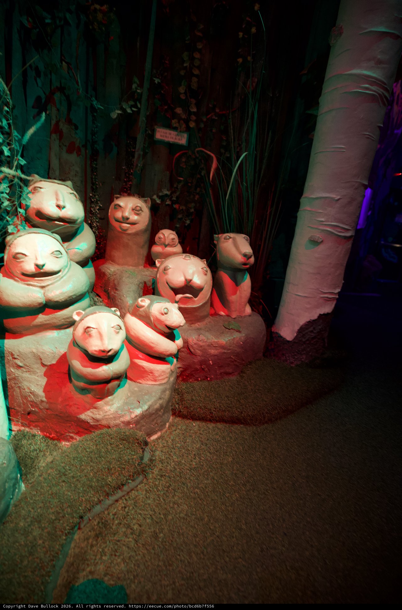 Whimsical Clay Ferret Sculptures in Themed Display
