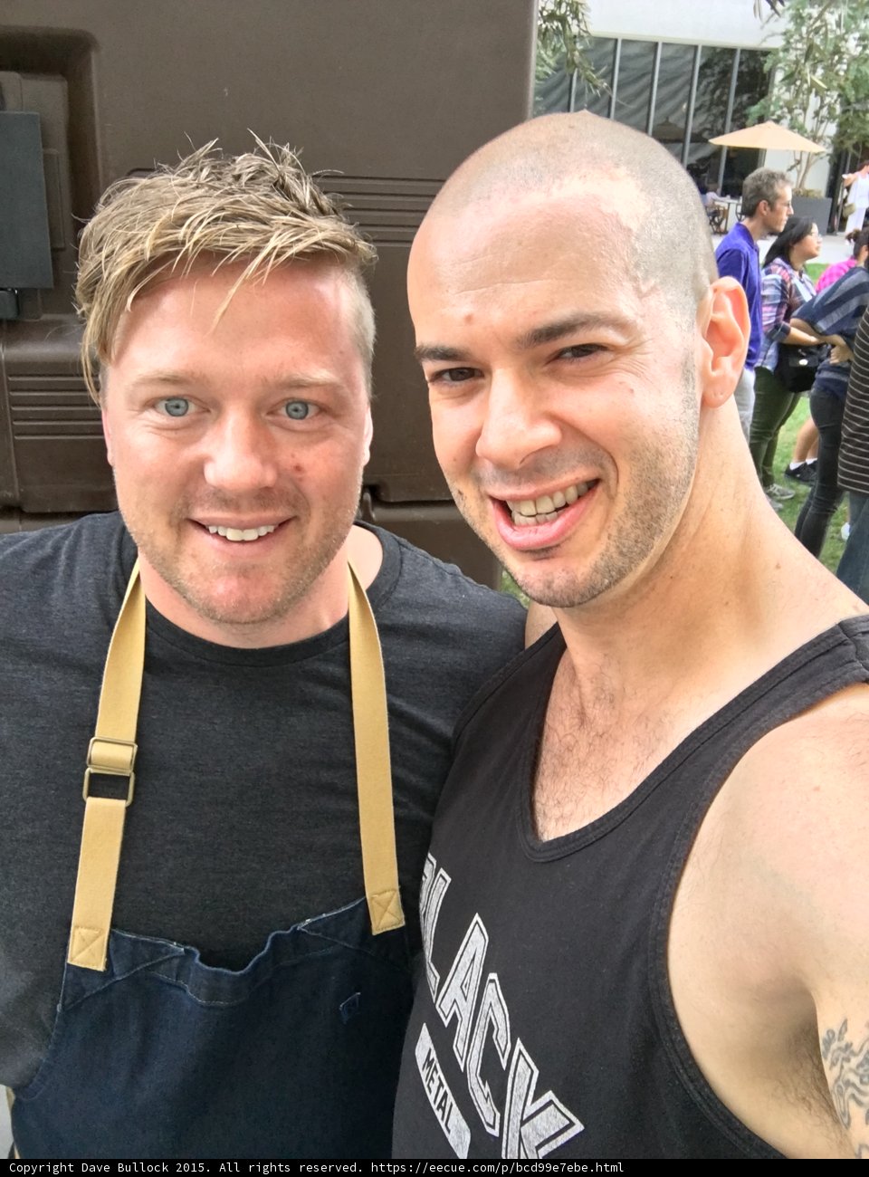 Two Smiling Men in front of a Truck