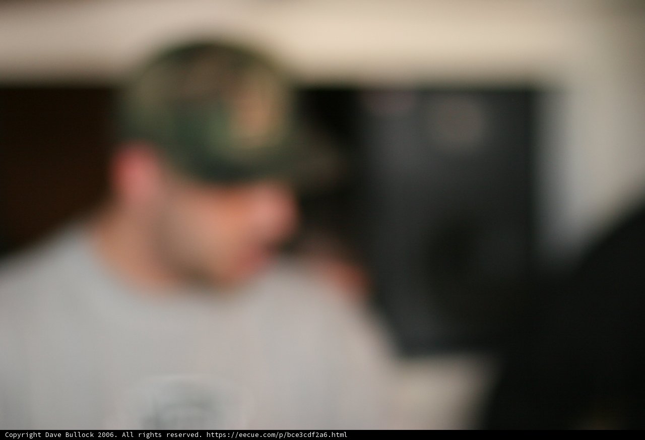 Blurred Man in Baseball Cap