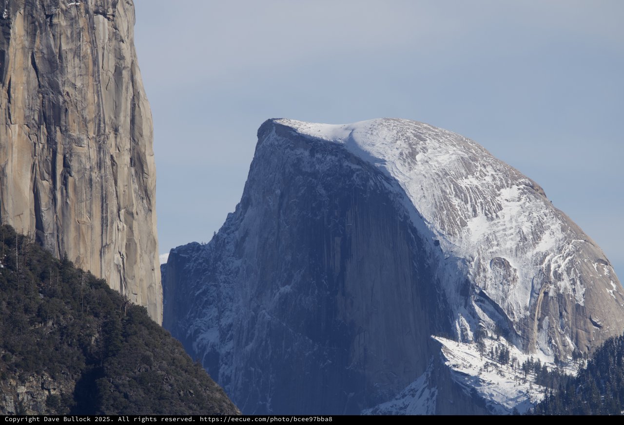 Half Dome's Iconic Silhouette Framed by El Capitan
