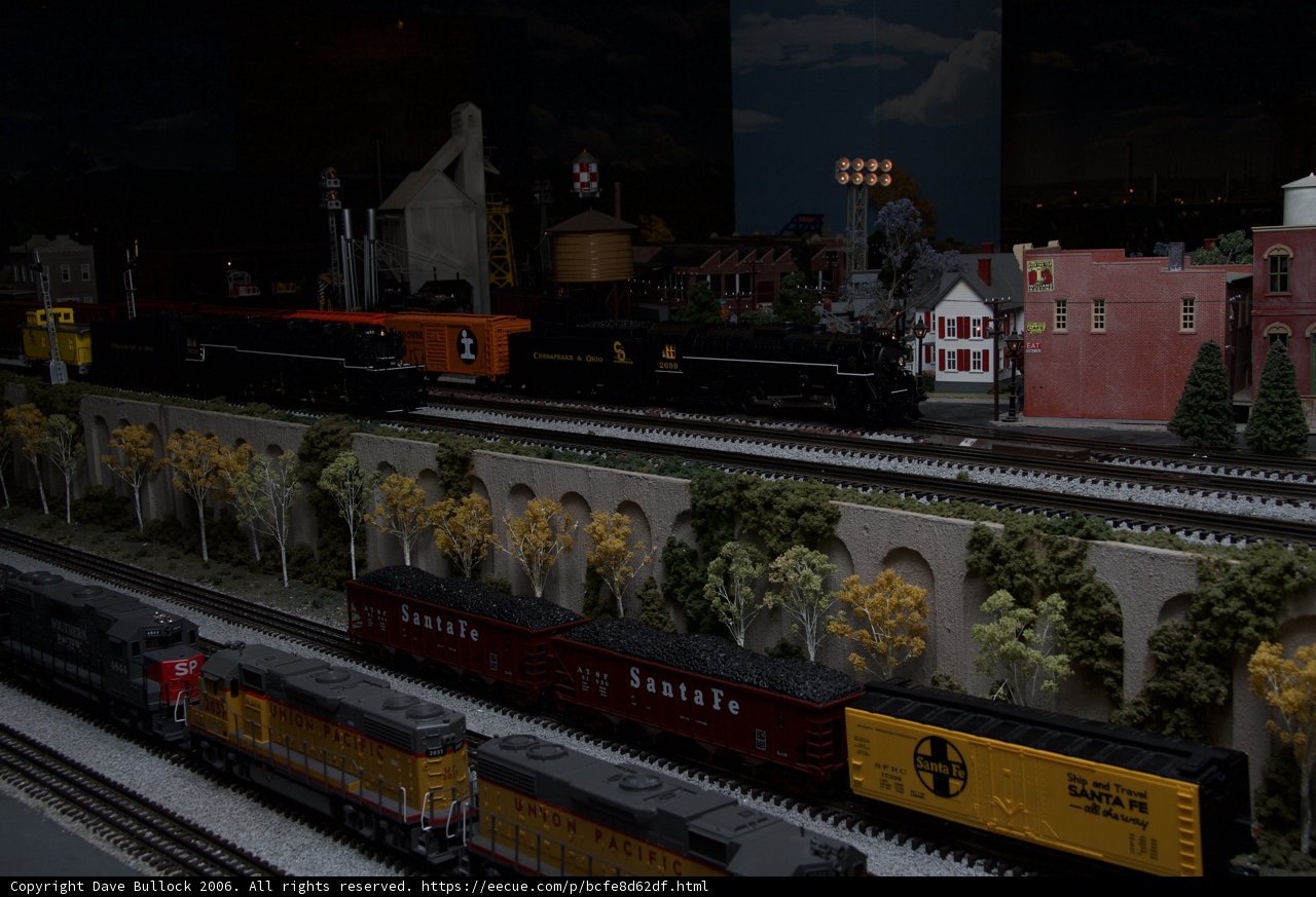 Miniature train journey through a bustling city