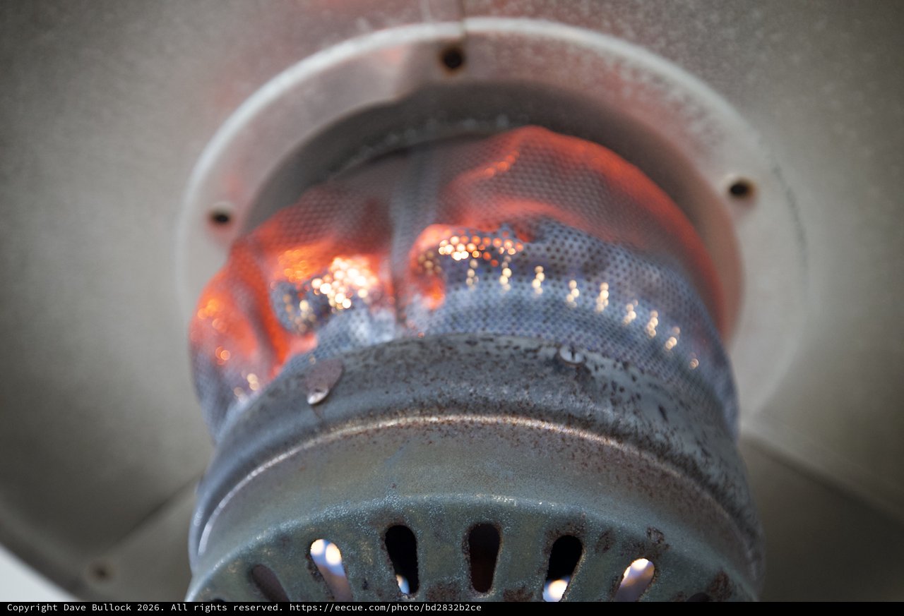 Glowing Flames Inside a Metal Burner Chamber