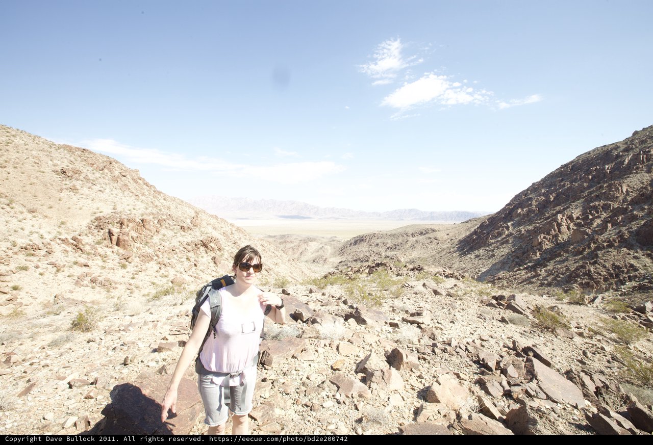 Desert Hiker Pauses at Rocky Canyon Pass