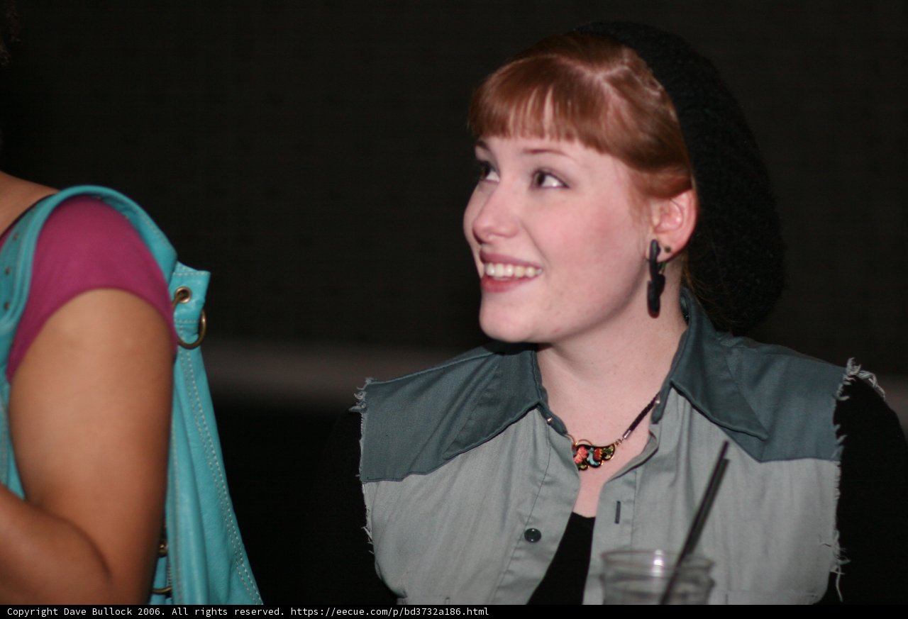 Fashionable Woman in Black Hat and Blue Shirt