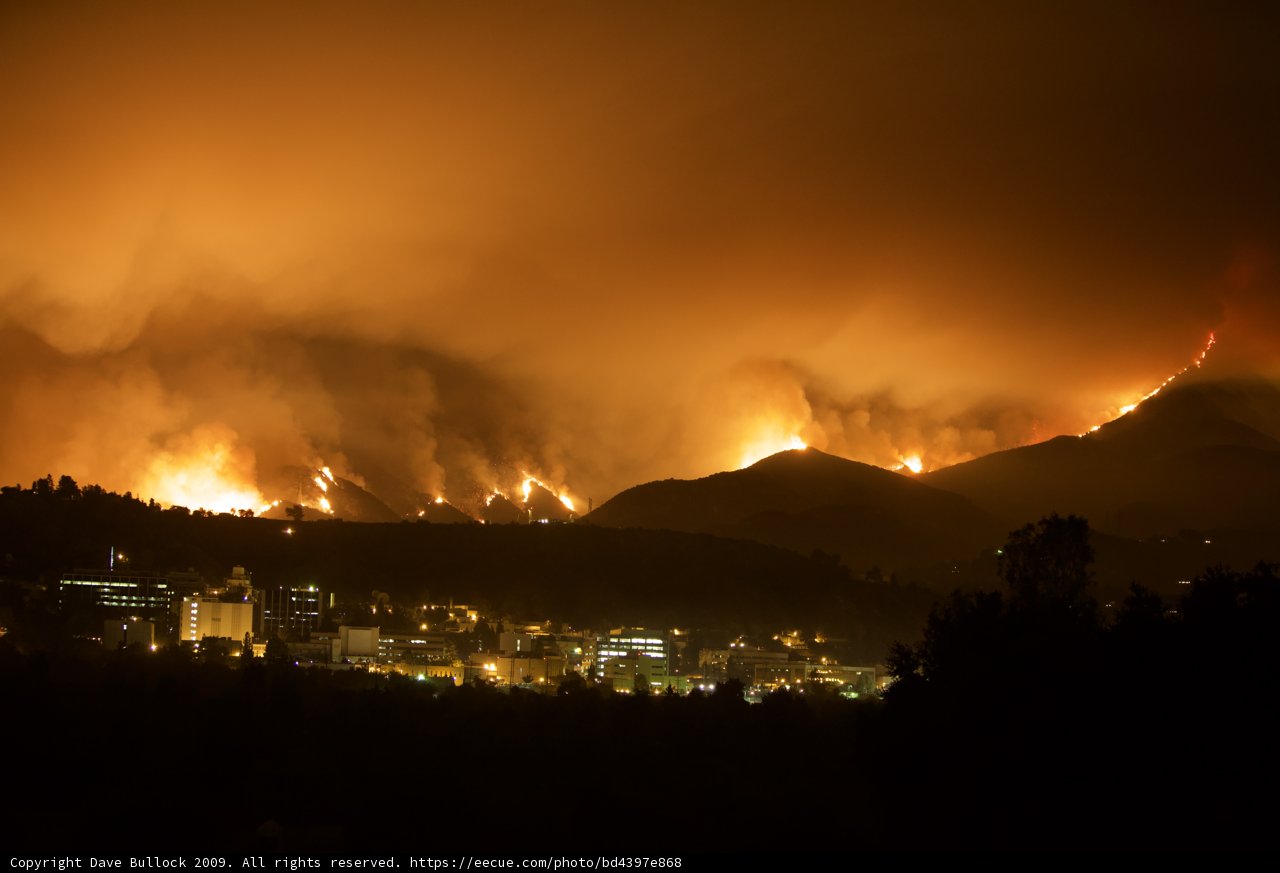 City Lights and Mountain Flames