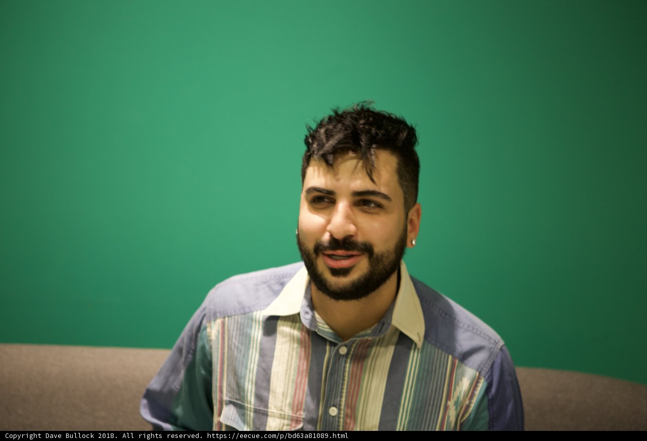 A Happy Man on his Striped Couch