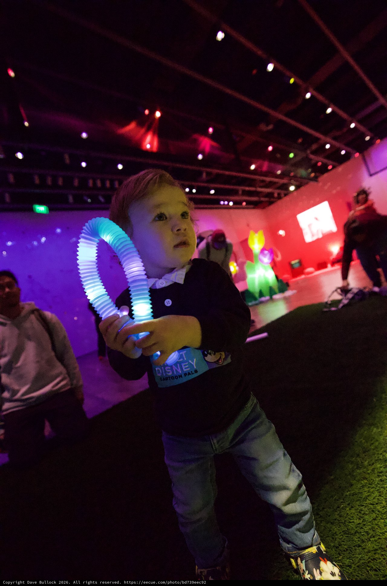 Child with Glowing Toy at Baby Rave Event
