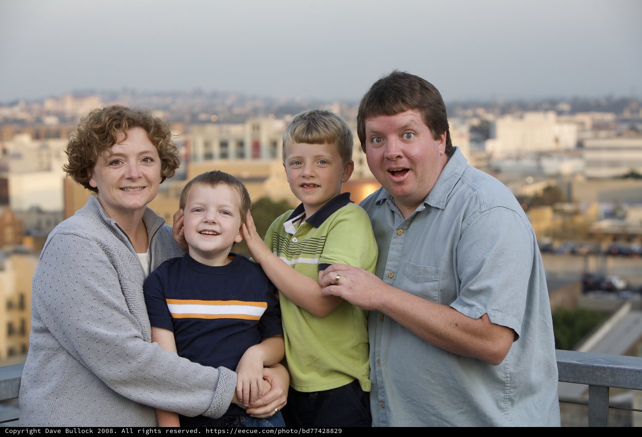 Family Portrait on Urban Rooftop at Dusk