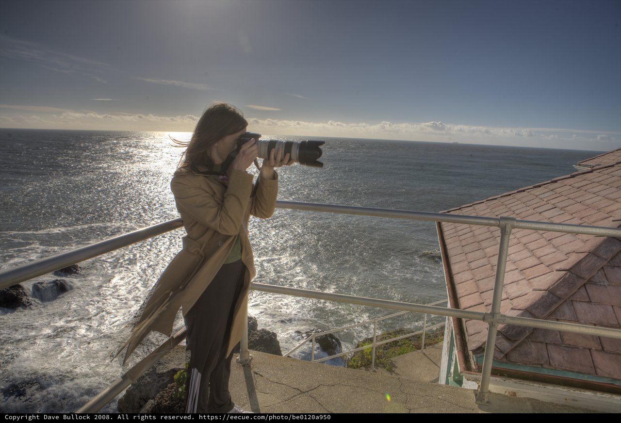 Photographer Capturing the Pacific Ocean at Cliff's Edge