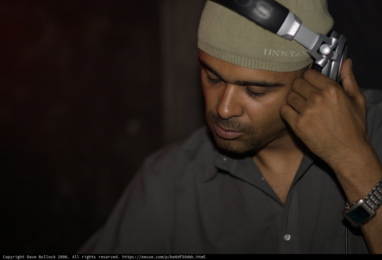 Hat-Wearing Man on his Cell Phone