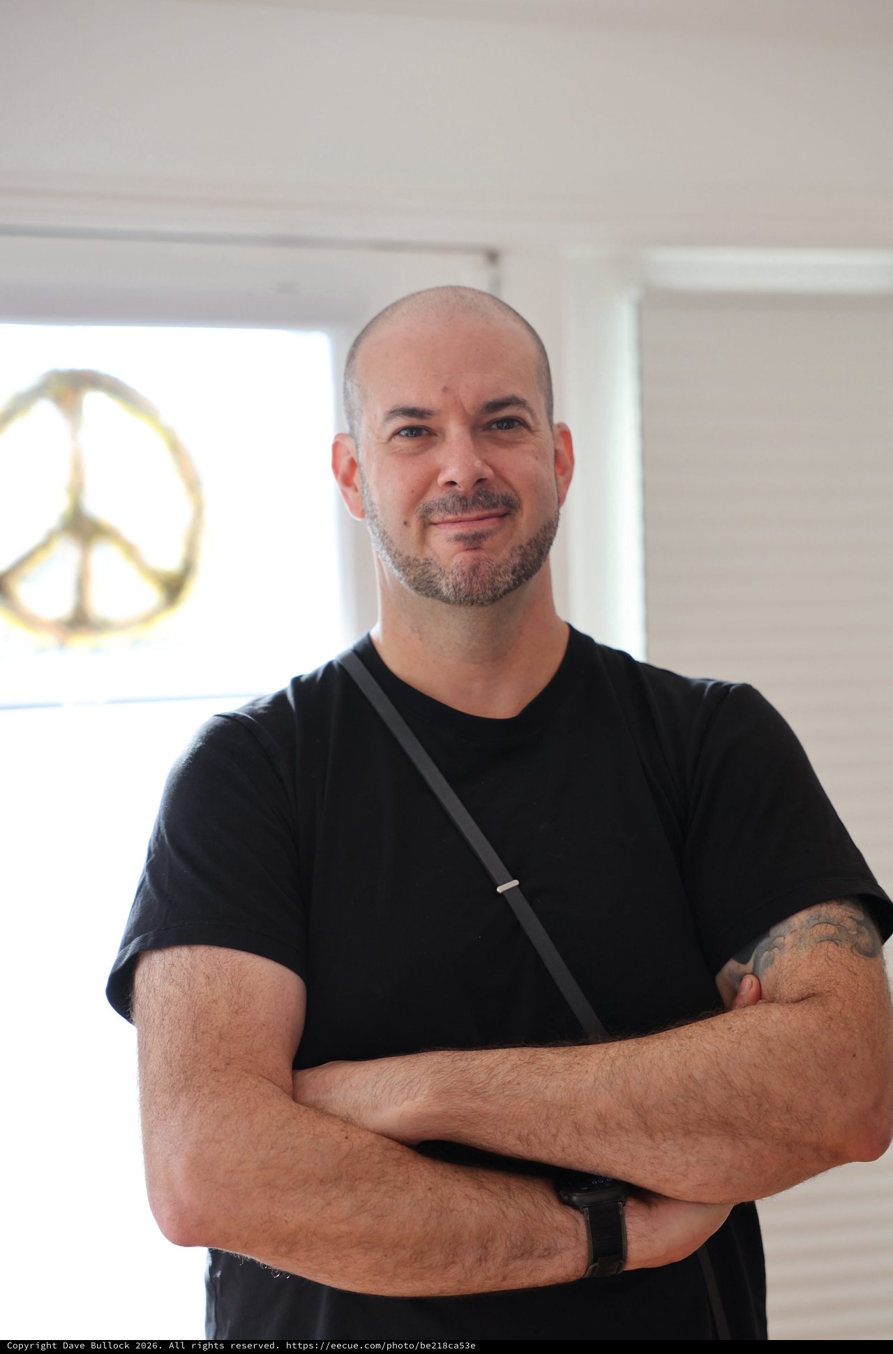 Portrait of Man in Black Shirt with Peace Sign