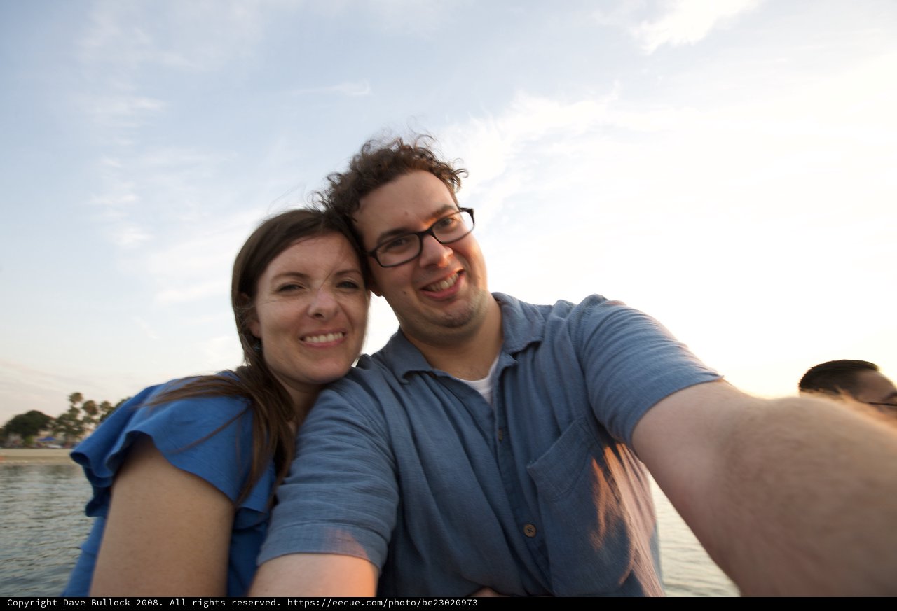 Couple's Joyful Selfie at Beachside Sunset