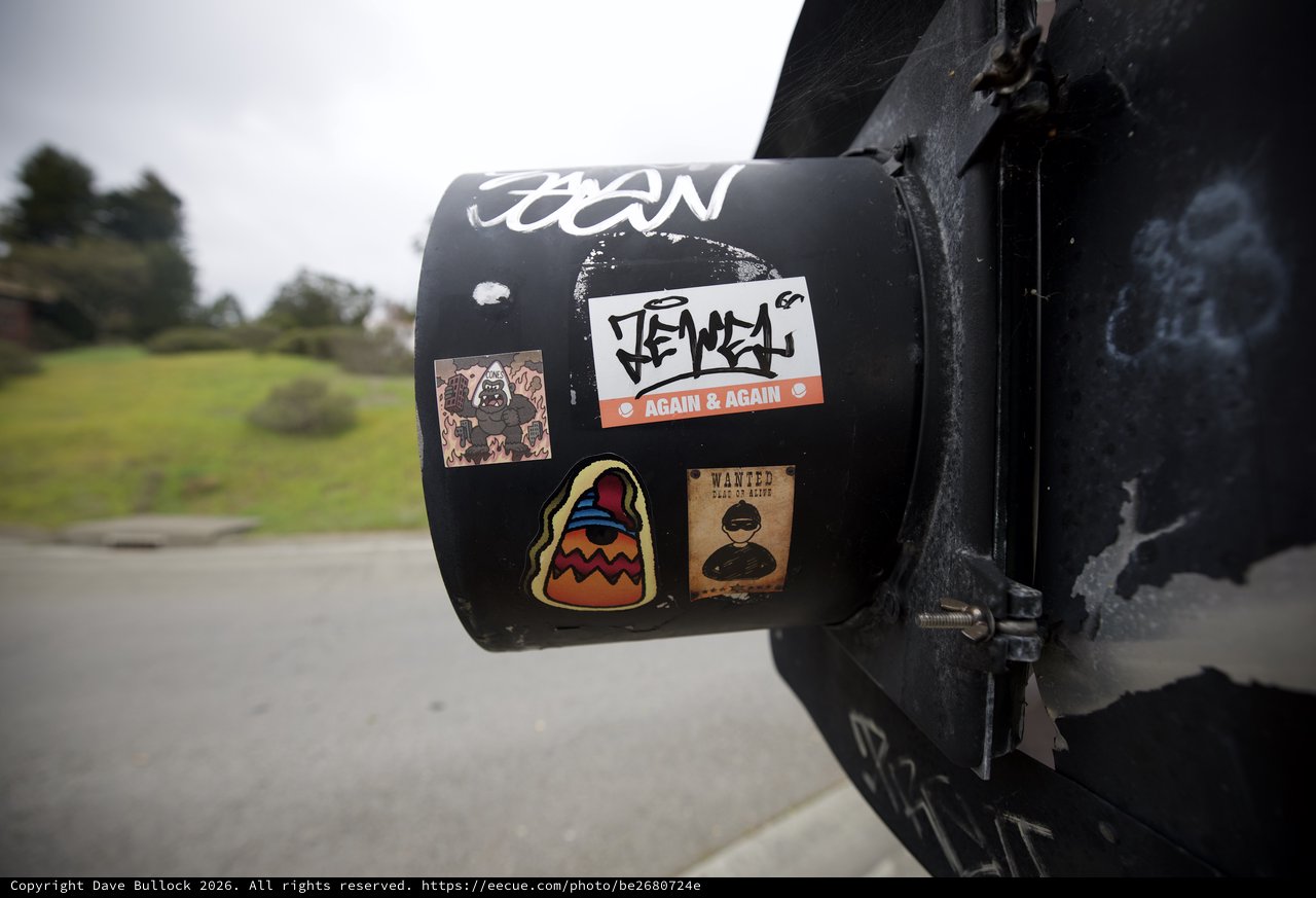 Travel Stickers on Black Cylindrical Post