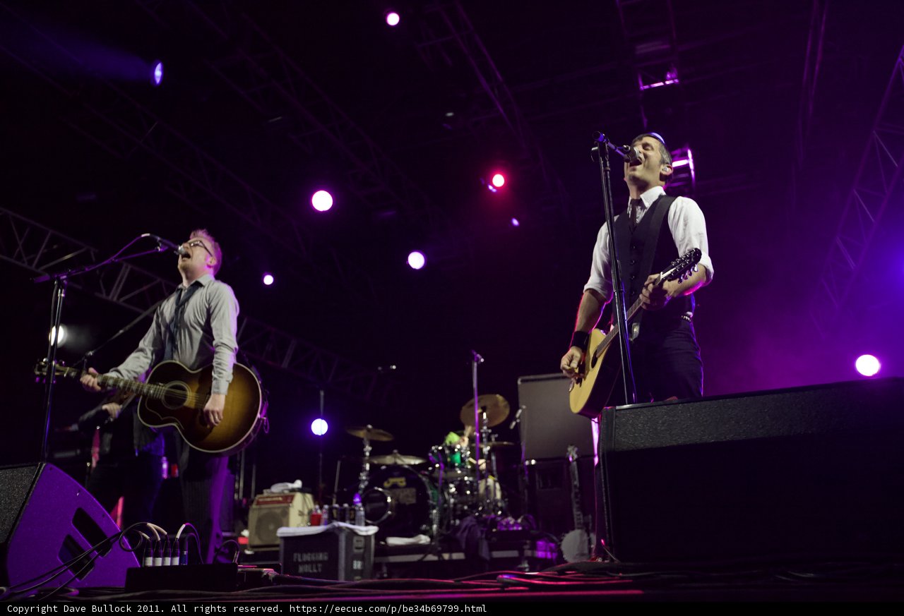 Two Musicians Rocking Out on Stage