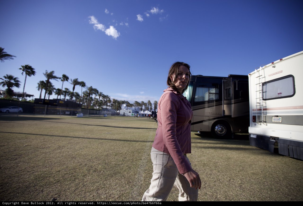 Woman Strolling Through Coachella Festival Grounds at Dusk