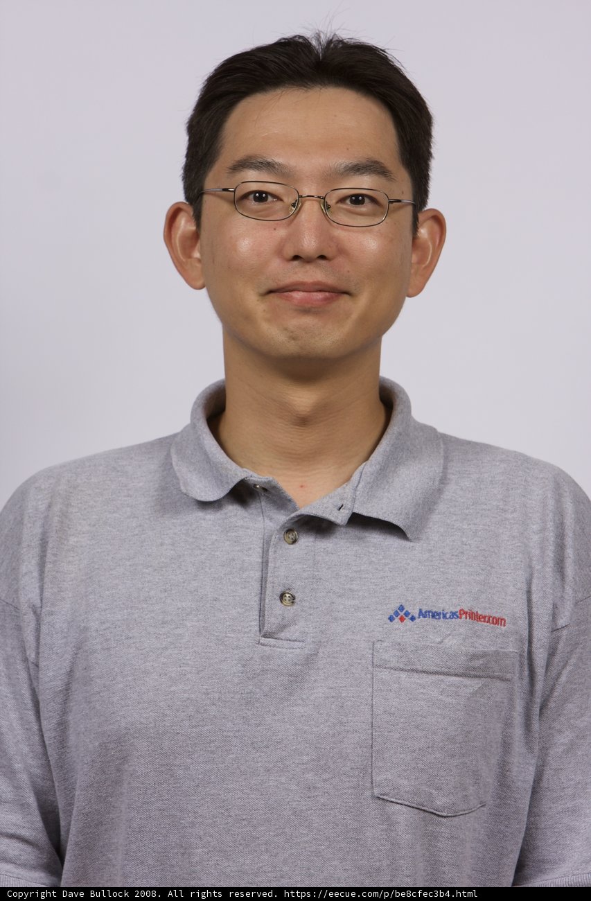 Hiroaki Ogi in Grey Shirt and Glasses