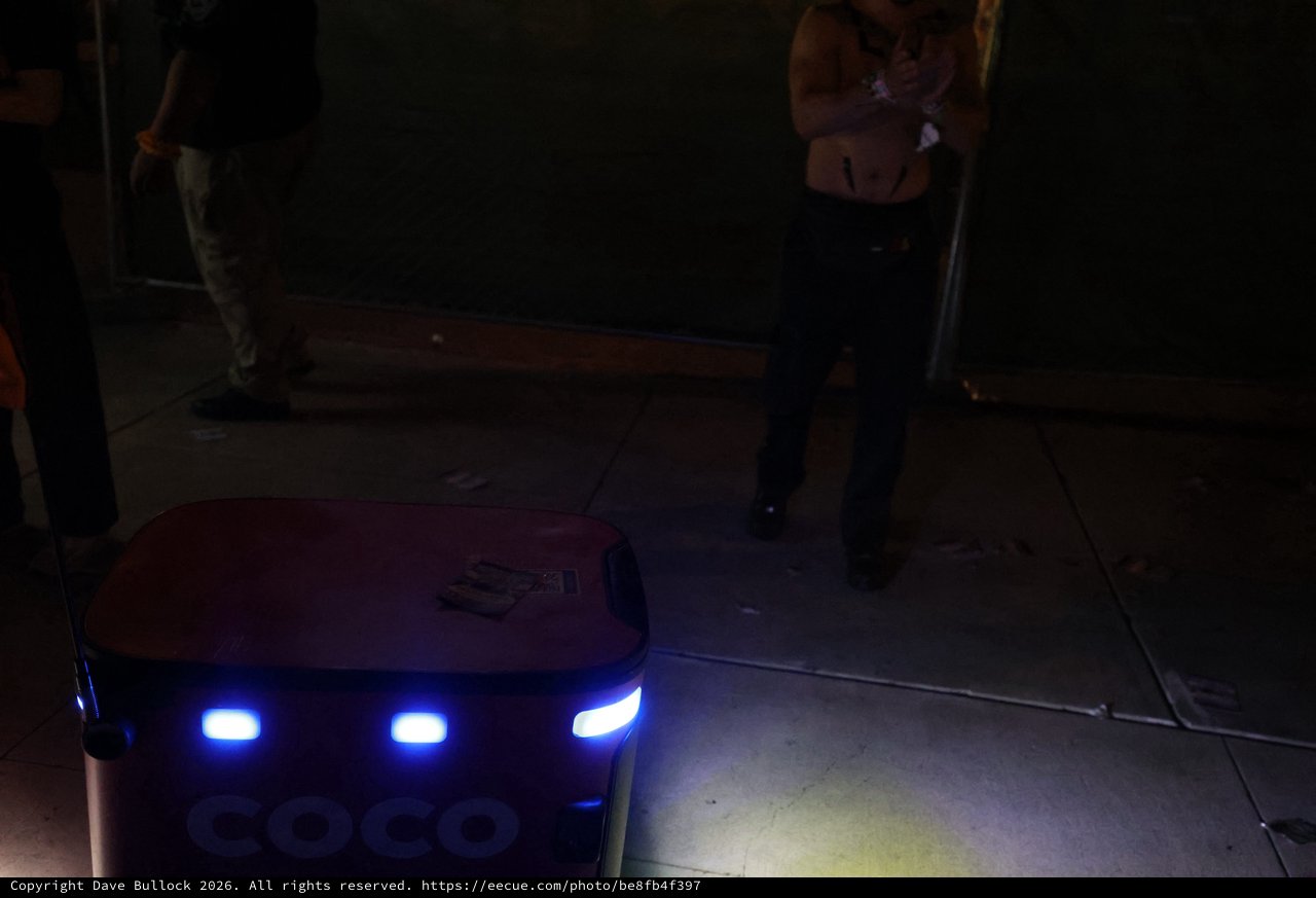 Coco Delivery Robot Navigates Nighttime Festival Crowd