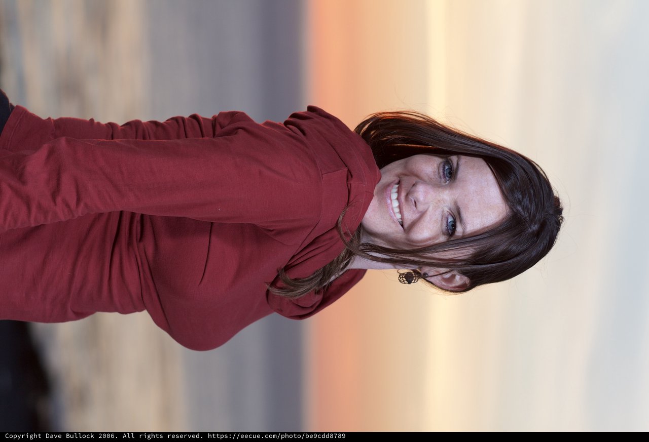 Smiling Woman at Golden Hour Coastal Sunset
