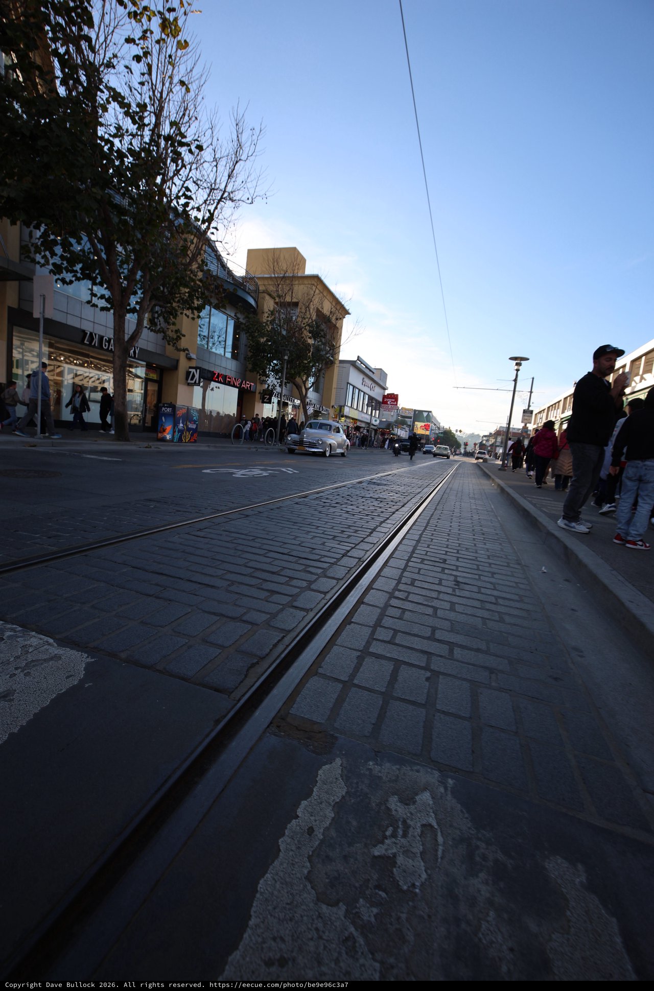 Twilight on a European Shopping Street with Tram Tracks
