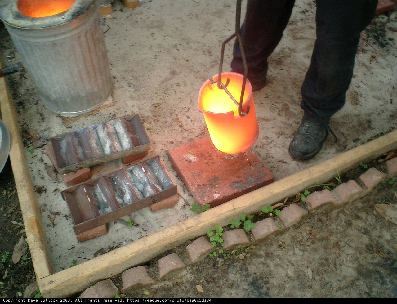 Crafting Light with Fire Caption: A skilled artisan creates a handmade lamp using a torch and traditional techniques in a forge.