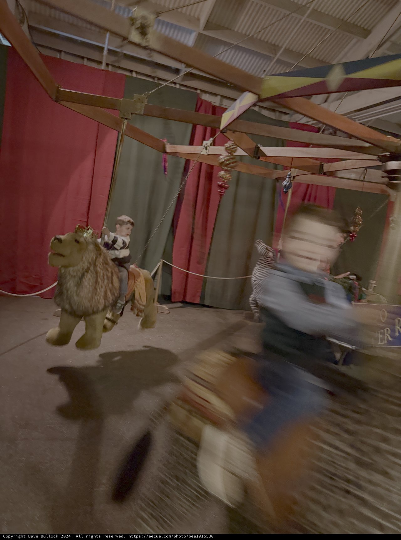 Vintage Carousel in Motion at Fairground