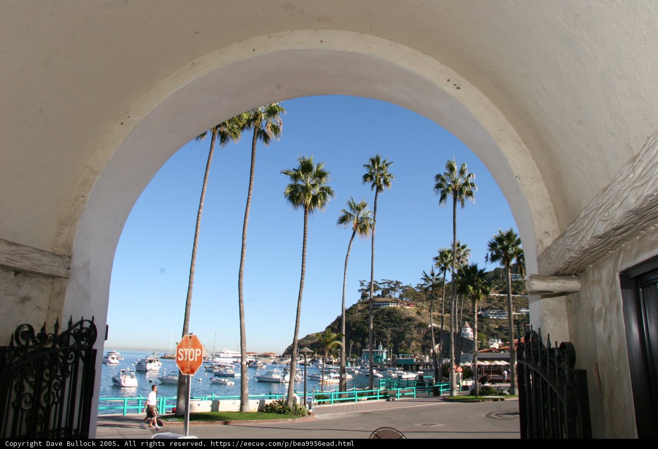 A Serene Harbor View from an Archway