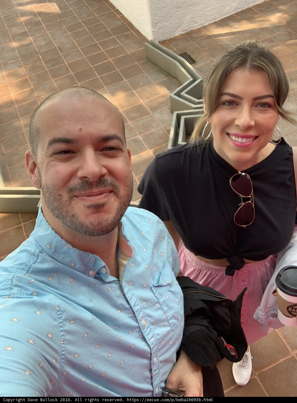 Smiling Couple Takes Selfie on Stairs