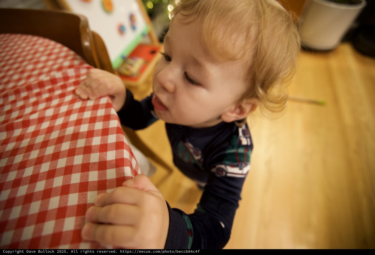 Young Child Drawing at Table on Christmas Morning