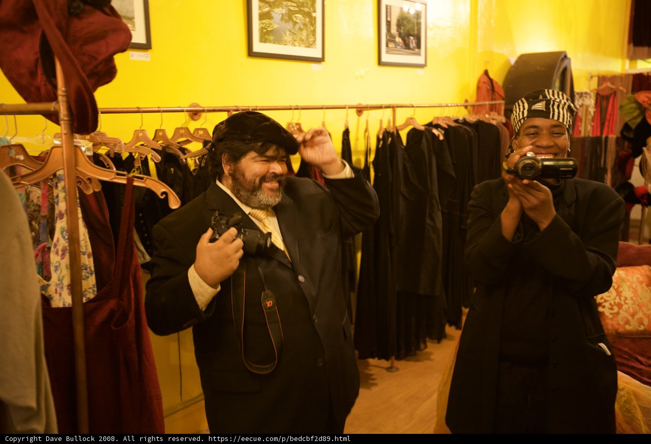 Two Men in Formal Coats in an Artistic Room
