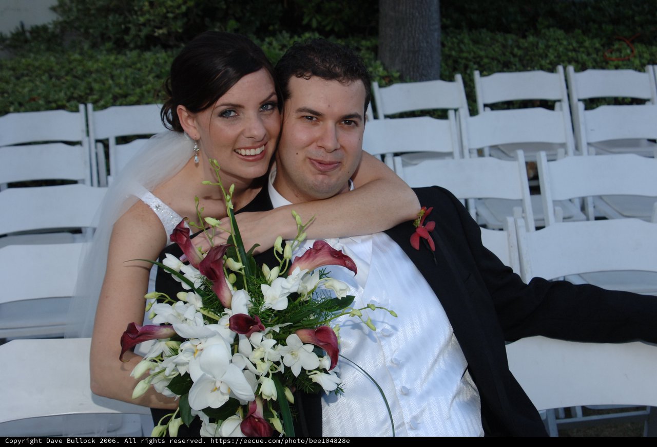 Newlyweds Embrace After Outdoor Wedding Ceremony