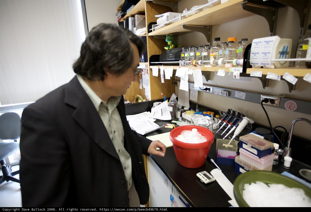 Lab Coated Scientist Conducts Nanomachines Experiment