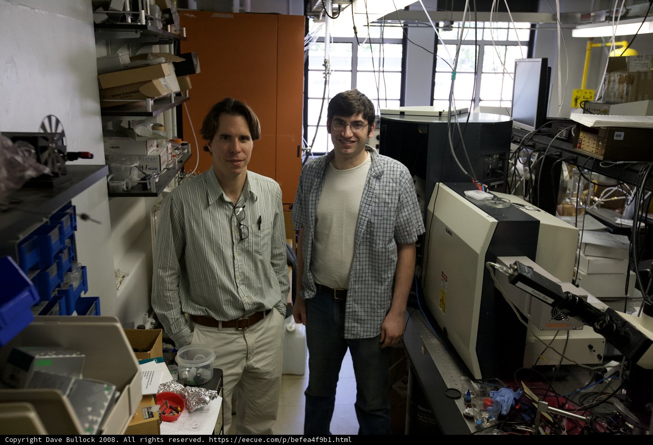 Two Men Working on Computer in Laboratory