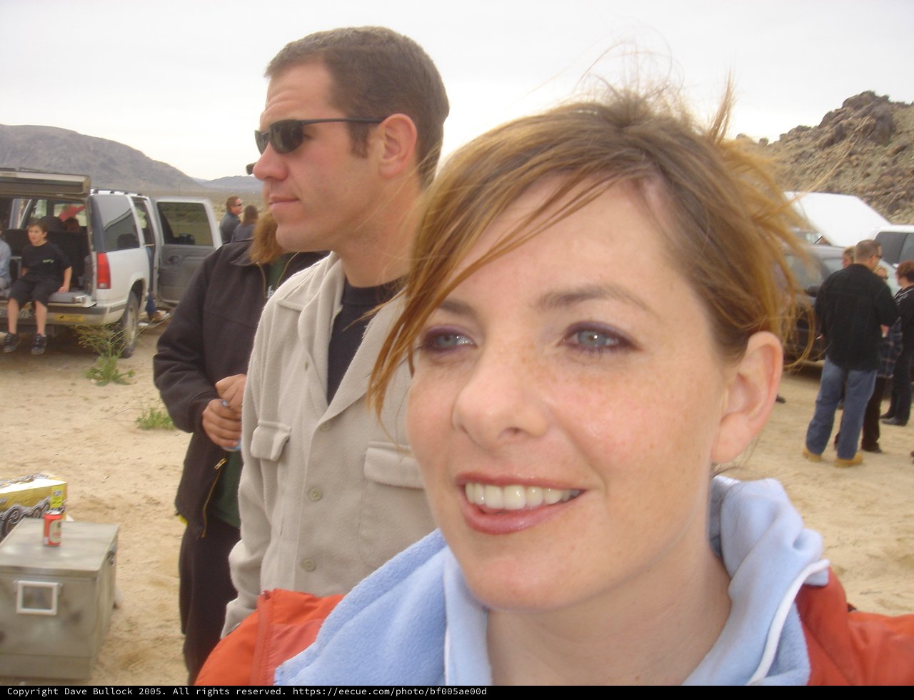 Candid Desert Gathering with Two People in Foreground