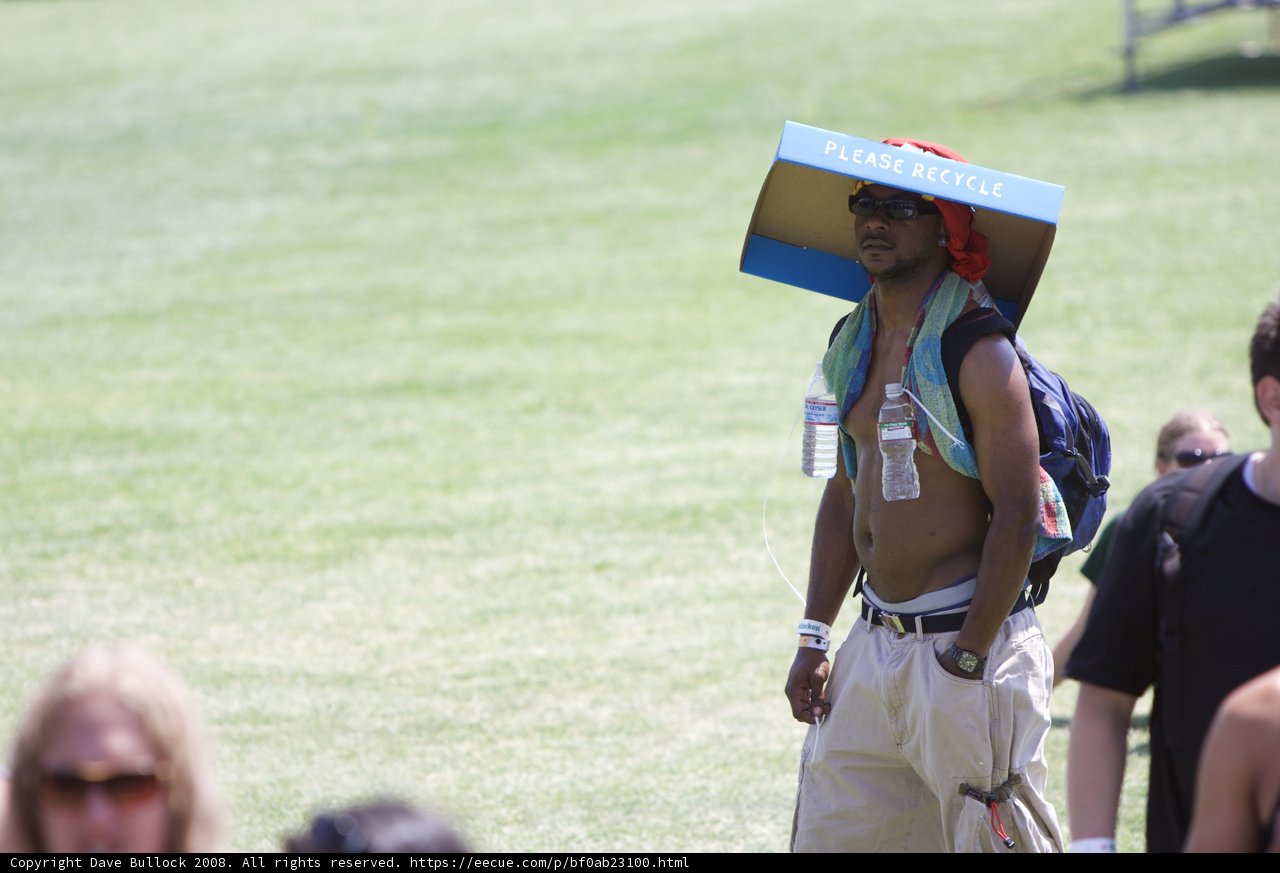 Box-Carrying Man with Sun Hat