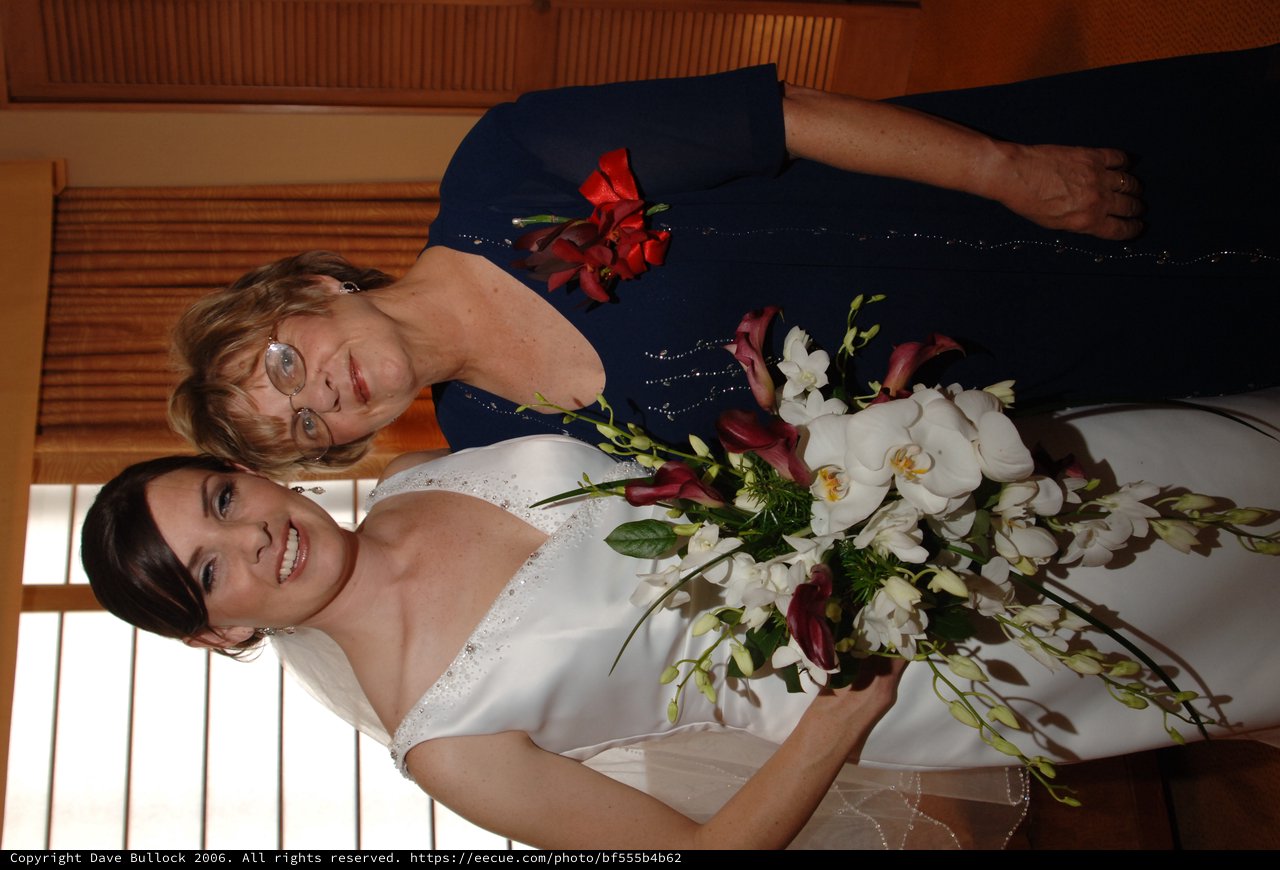 Bride and Mother Share a Joyful Wedding Day Moment