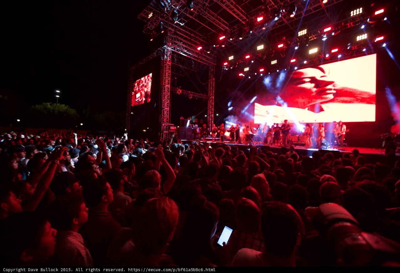Belle and Sebastian Wide Stage Crowd Phones Recording Video Screen Trees Stadium Lights Night