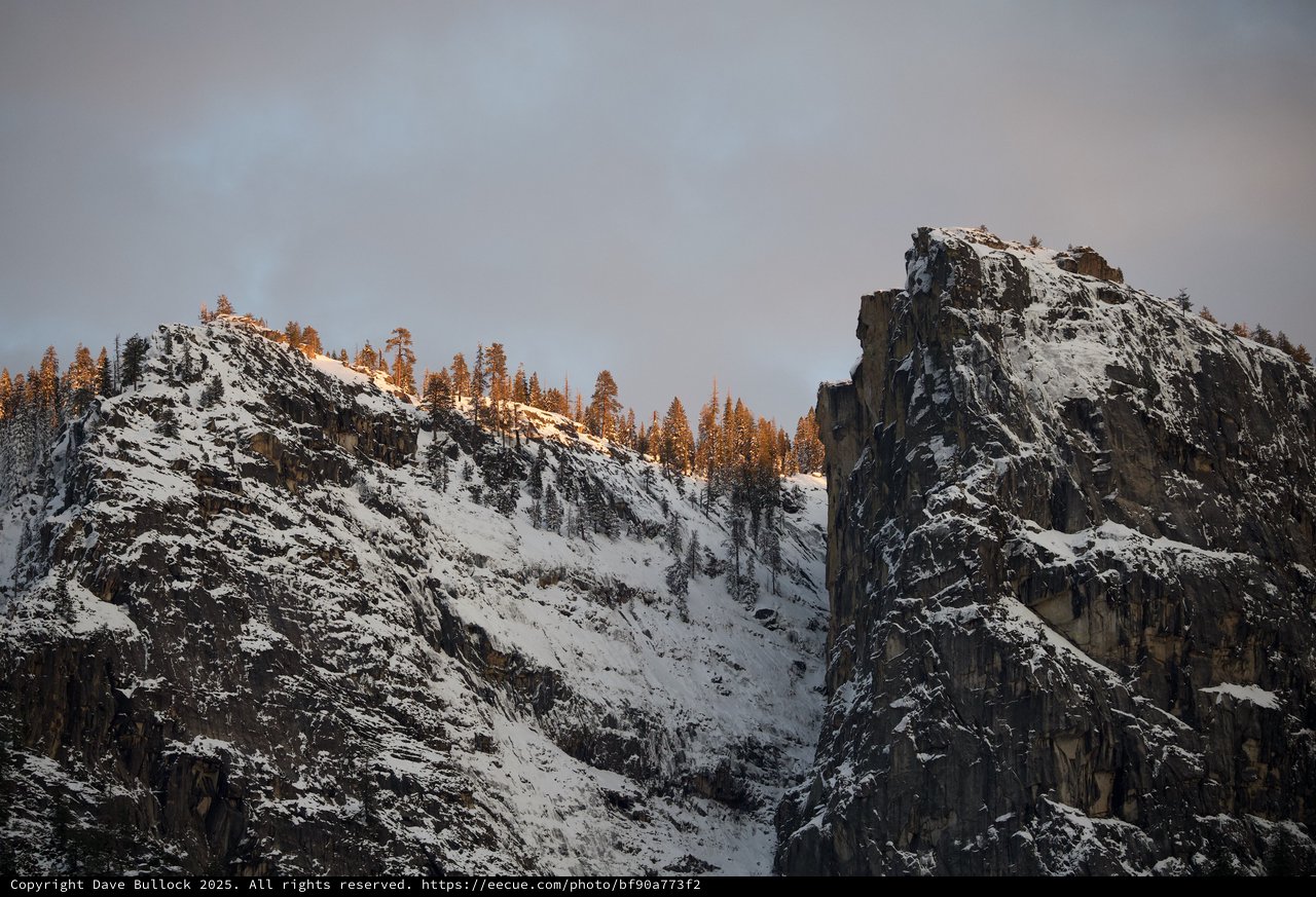 Golden Hour Light on Snow-Covered Mountain Peaks