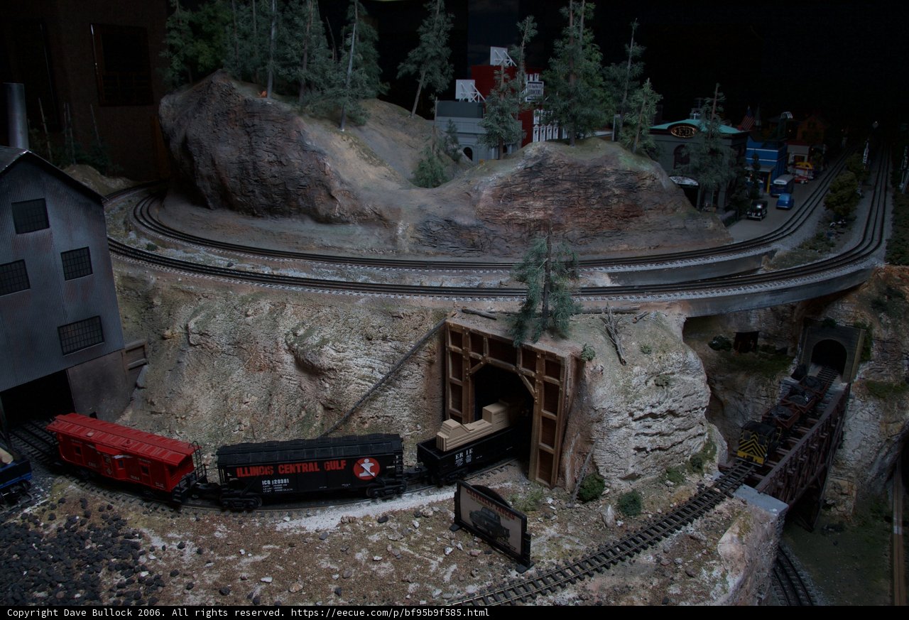 Miniature Train Making Its Way Through a Tunnel