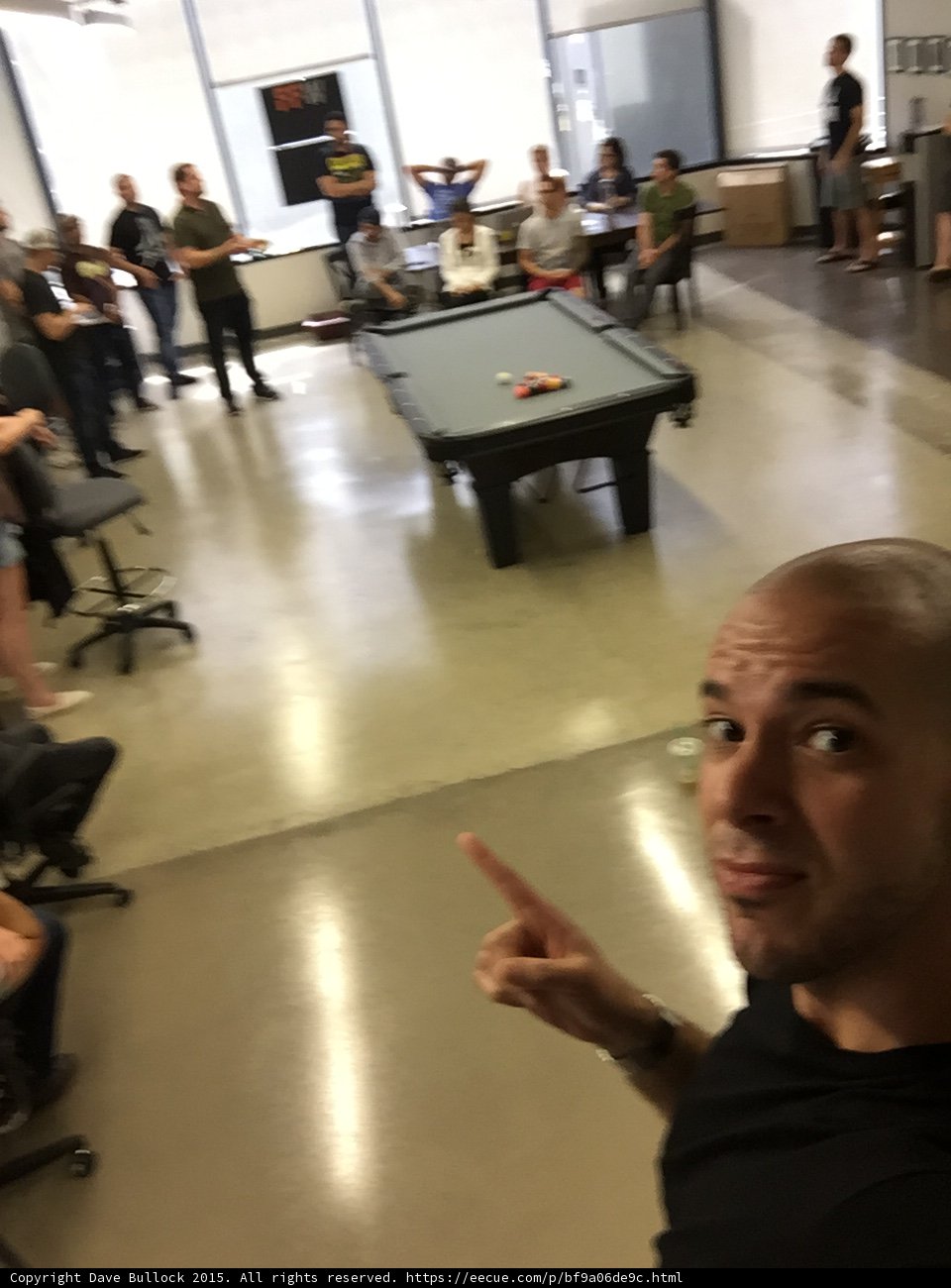 FFW Office All Hands Meeting Selfie Pointing Pool Table Employees Gathered Tech Startup Interior Expressive