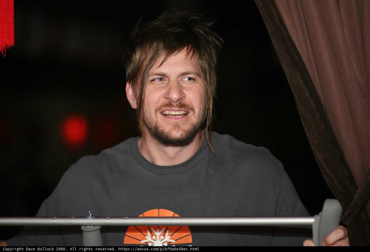 Bearded Man Smiling in a Basketball Tee
