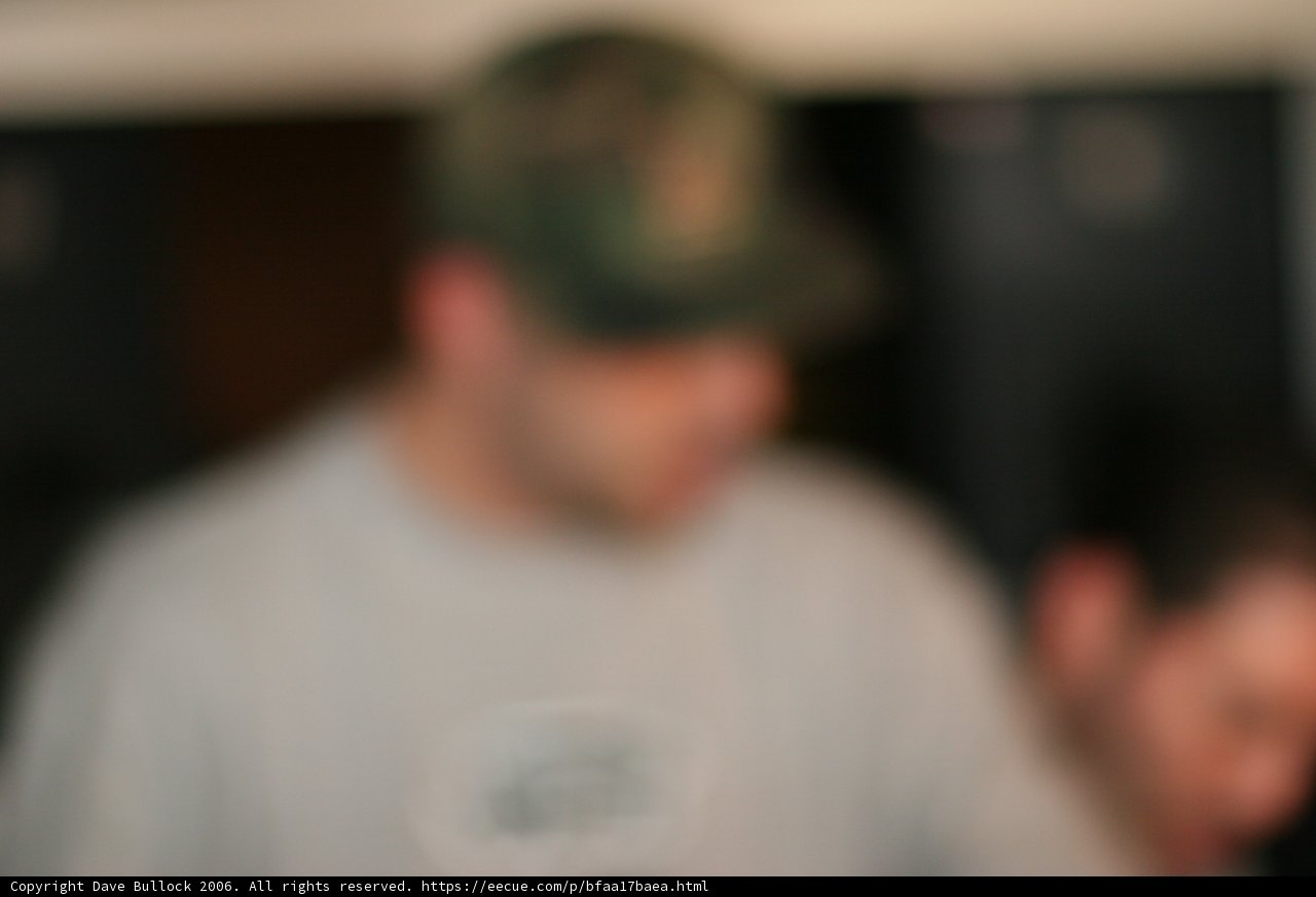 Blurry portrait of a man in a baseball cap