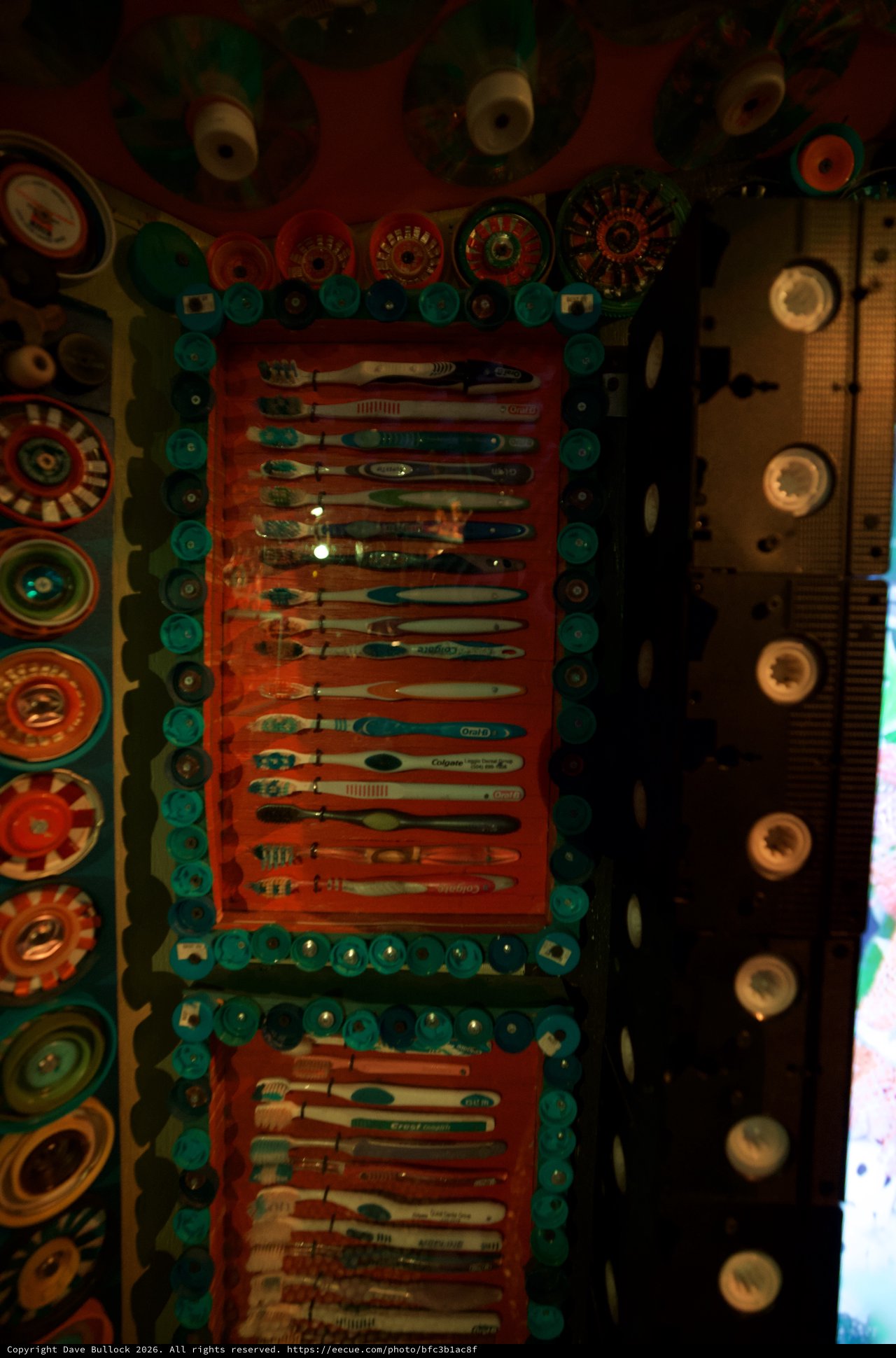 Colorful Folk Art Display with Toothbrushes and Buttons