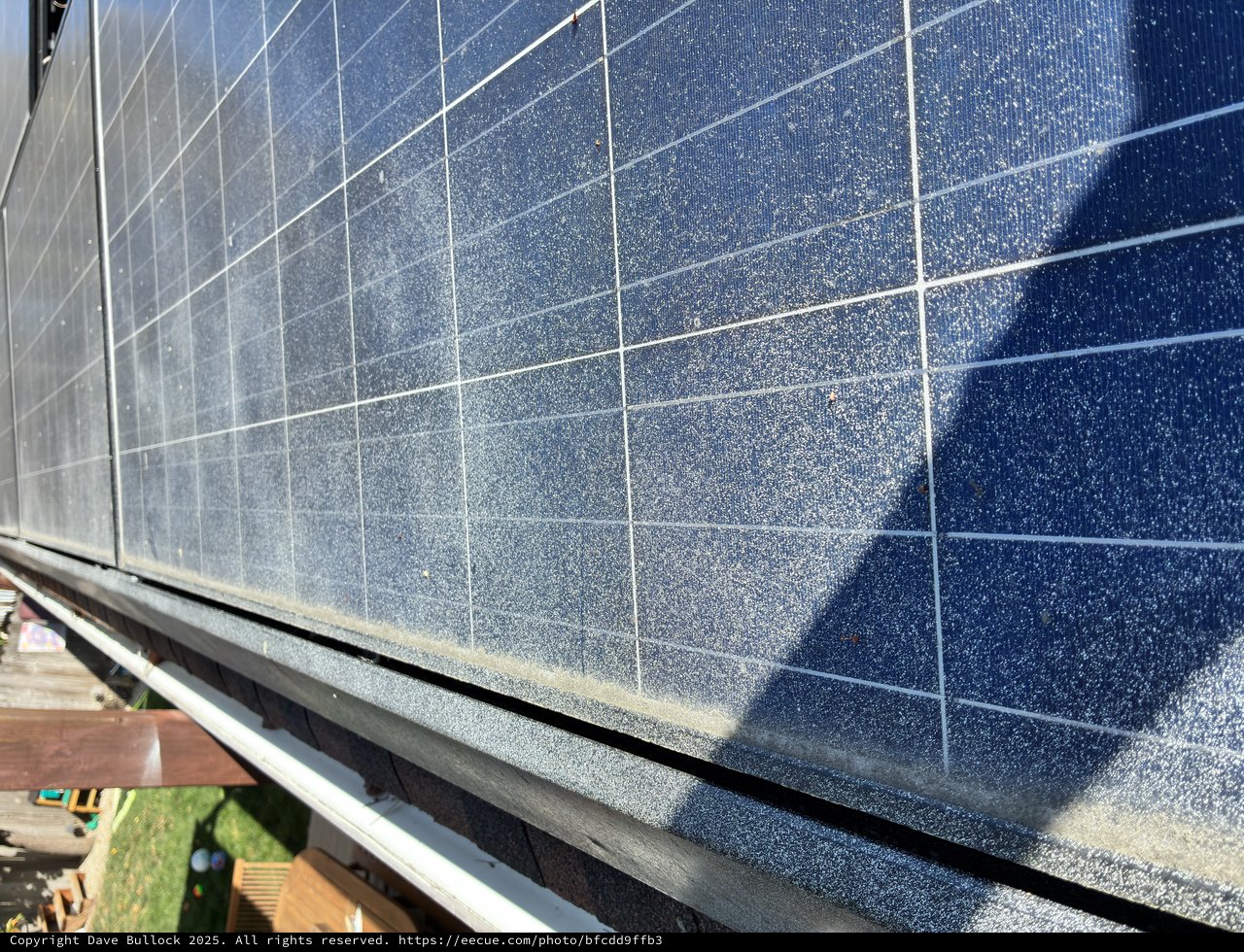 Dusty Solar Panels on Residential Rooftop Installation