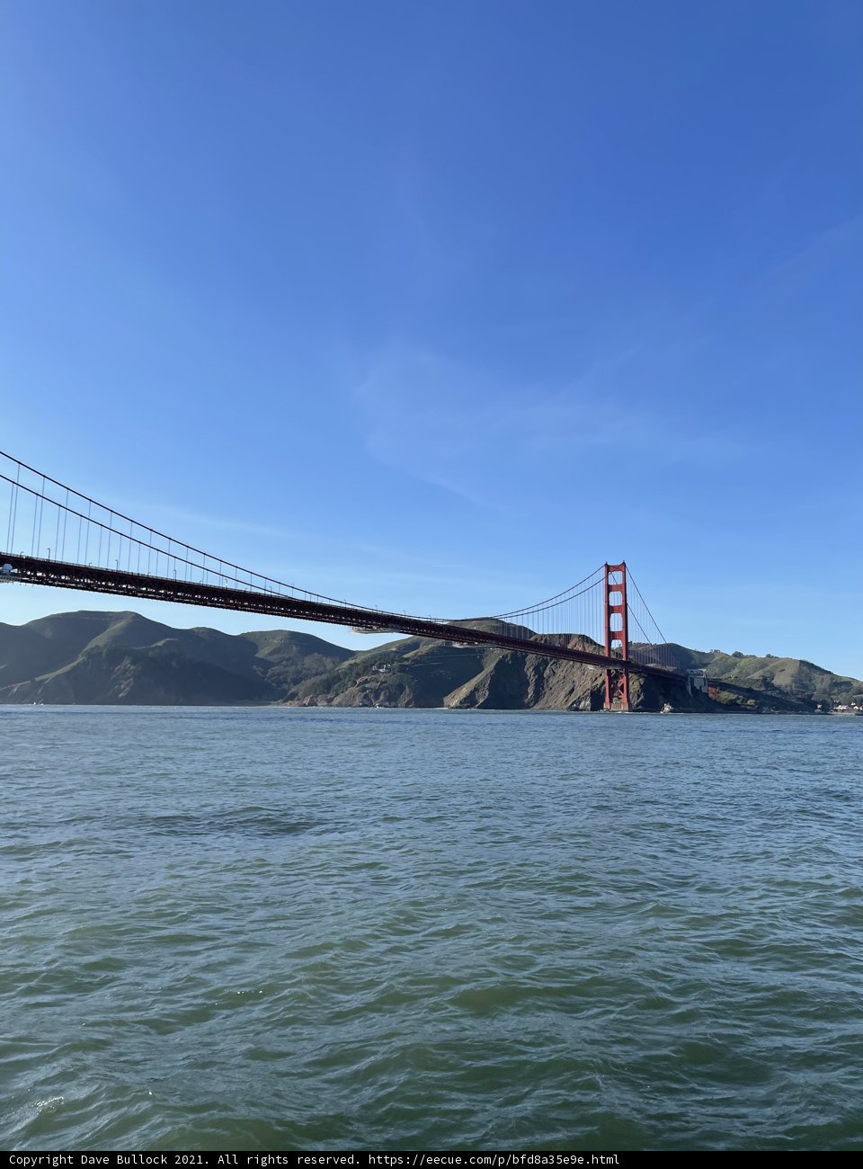 Golden Gate Bridge shining bright over San Francisco Bay