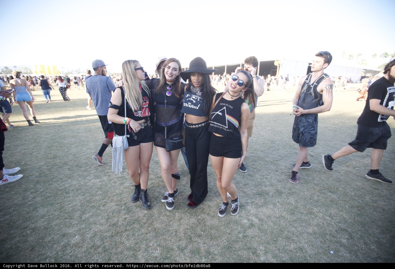 Three Girls Strike a Pose in Black Outfits