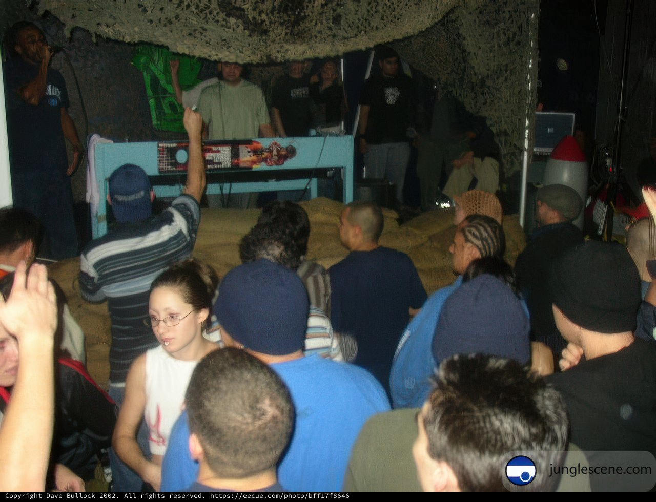 Nightclub Fun with a Cap-Holding Guy