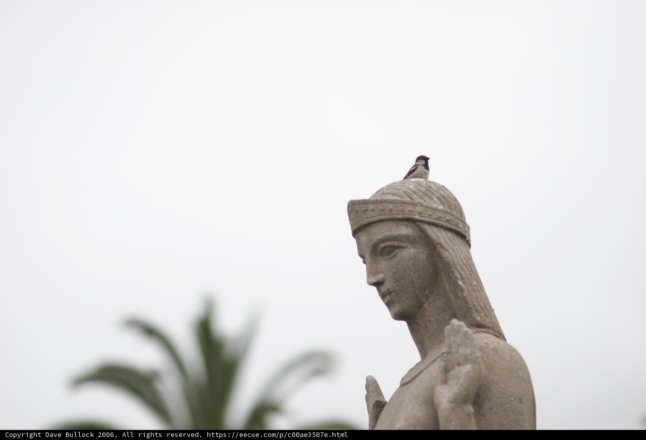 Bird-Topped Woman Statue
