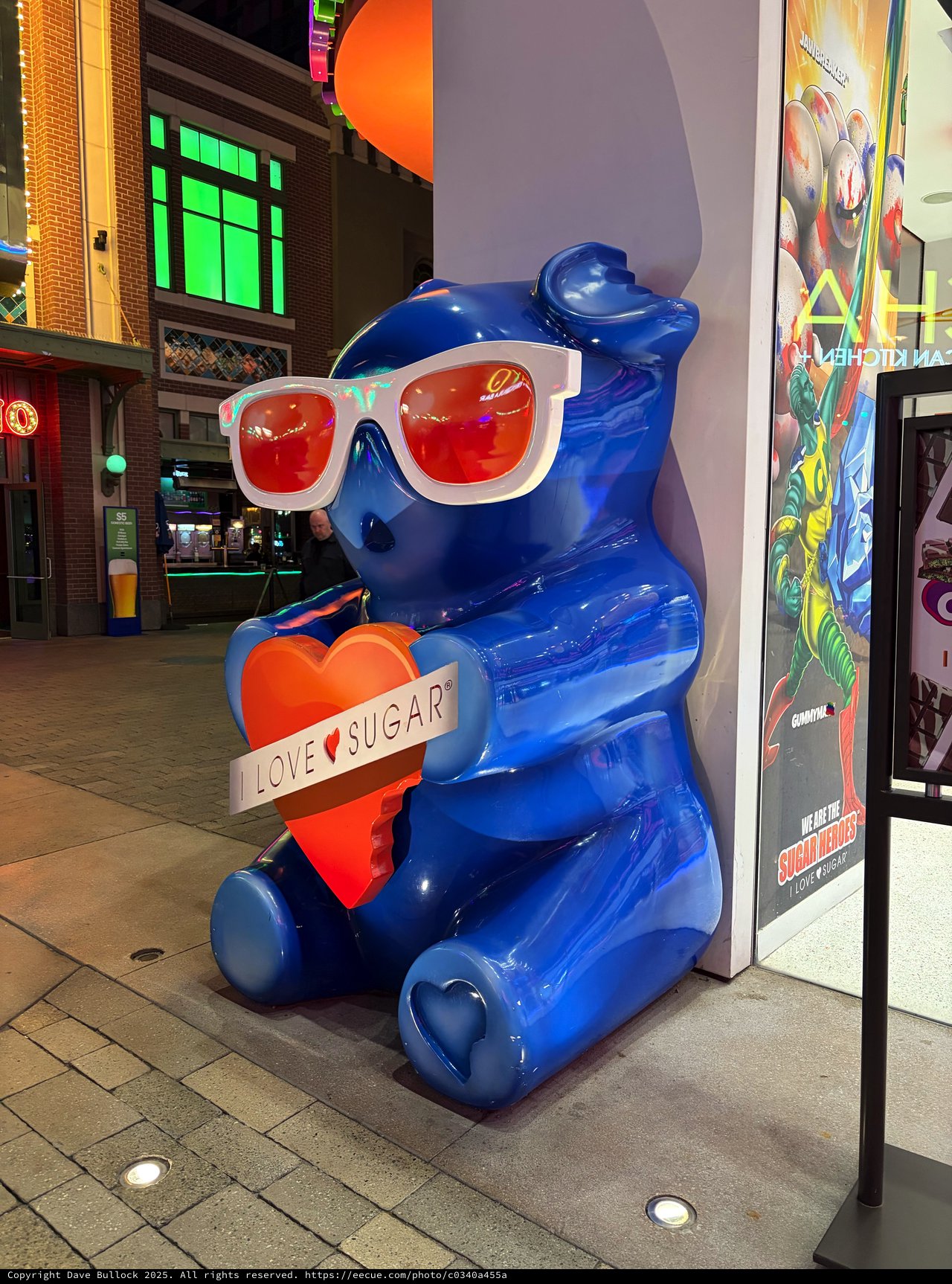 Blue Bear Sculpture with Heart and Sunglasses at Night